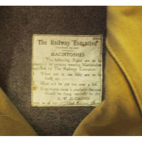 112 - British Railways (Western) long brown lined Mackintosh's, one slightly stained, one matching gaiter.... 