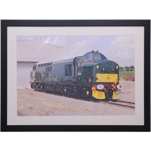 1179 - Framed official photo, 37 411 in green livery outside paintshop, 22