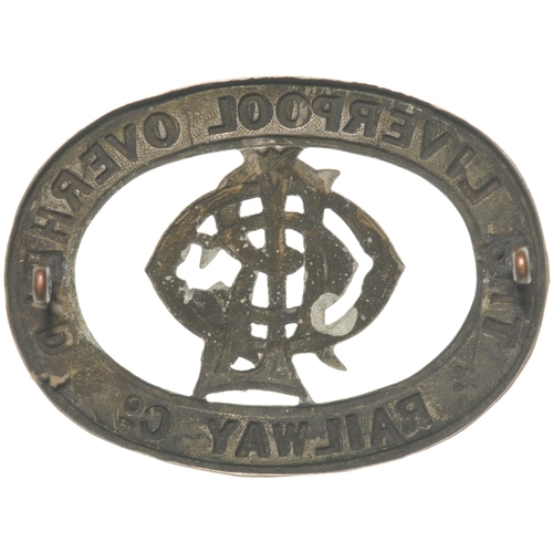 677 - Cap badge, THE LIVERPOOL OVERHEAD RAILWAY Co, nickel garter surrounding company monogram, 2¾