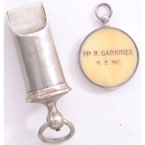 699 - NER barrel type whistle and a directors pass, bone, featuring coat of arms, MR R GARDINER, in silver... 