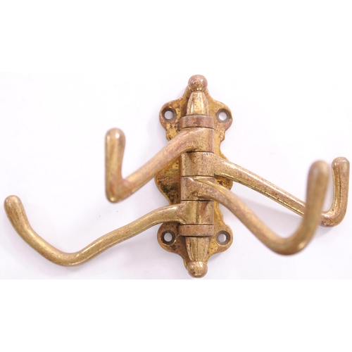 702 - GWR four-way coat hook, comprising wall bracket stamped GWR and four hinged hooks, unusual.