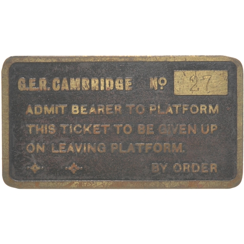 34 - A Great Eastern Railway brass platform ticket for Cambridge Station No 27, brass, 2¾