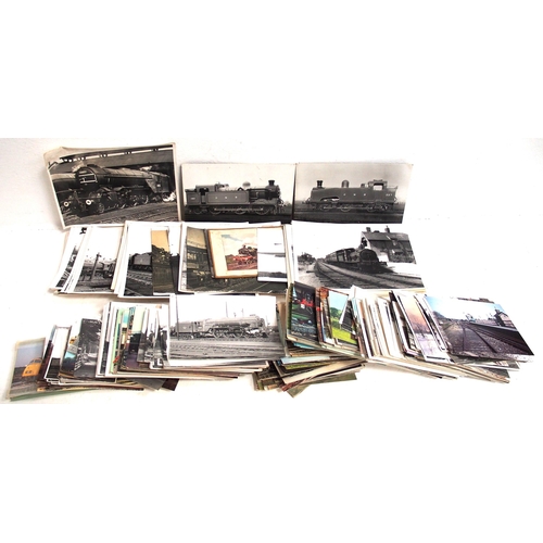 1010 - A collection of Black and White photographs and postcards both loose and housed in three album, a qu... 