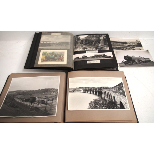 1010 - A collection of Black and White photographs and postcards both loose and housed in three album, a qu... 