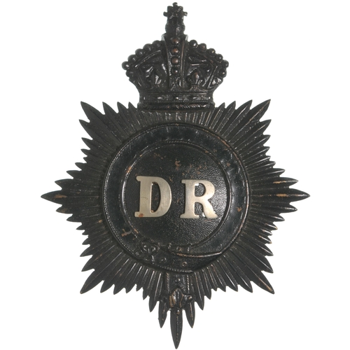 63 - A policeman's helmet badge, DISTRICT RAILWAY, embossed brass with nickel initials, 3⅝