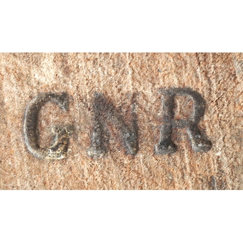 42 - GNR smokers chair in elm branded GNR on underside, good condition joints require tightening. (C1) (D... 