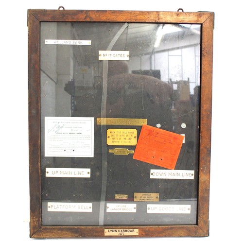 939 - Glass glazed (broken) wooden framed notice board containing a number of signal box instrument plates... 