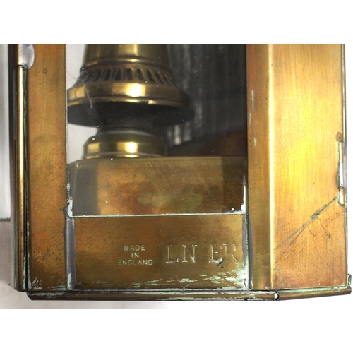 302 - Wall paraffin lamps, one brass cased standing 16