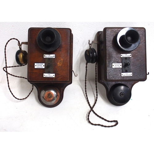 819 - Two D type wooden wall telephones with separate mouth & ear pieces, a matching pair originating from... 