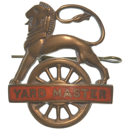 A BR(NE) lion over wheel cap badge, YARD MASTER, brass, with tangerine enamel panel. (Collect from Banbury Depot/Posted by Woodford Halse Office)