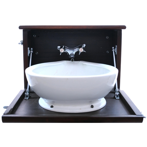 476 - A Pullman Car wash basin in a polished hardwood cabinet, complete with hot and cold taps, pipework a... 