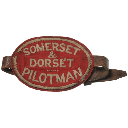 64 - An armband, SOMERSET & DORSET, PILOTMAN, embroidered felt with leather backing and straps, 5¼