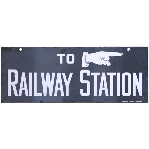 69 - A direction sign, TO RAILWAY STATION, with pointing hand. Double-sided, enamel, 22¾