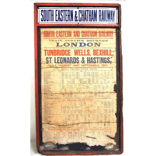 196 - SE&C Rly original wooden notice board with original enamel header & poster advertising Train Service... 