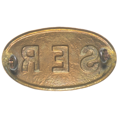 49 - A South Eastern railway driver's cap badge, enamelled brass, length 2