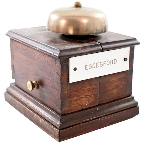 33 - A small block bell with split case, a trafolite plate, EGGESFORD, on the front, a box between Credit... 