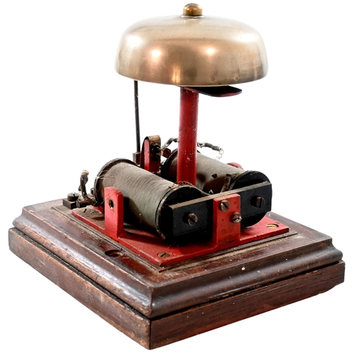 33 - A small block bell with split case, a trafolite plate, EGGESFORD, on the front, a box between Credit... 