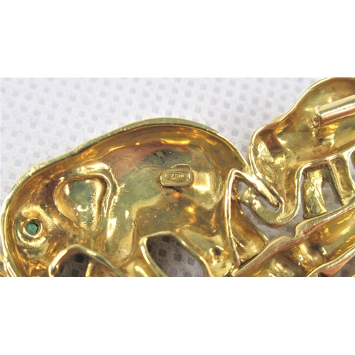 111 - A Good 18K Yellow Gold Brooch Cast as a family of Elephants walking on bamboo and inset with Emerald... 