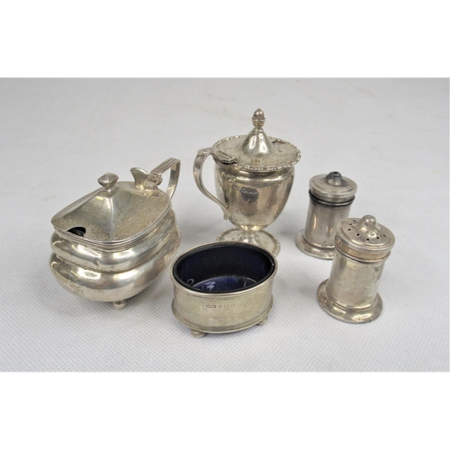 33 - Five Pieces of Silver Condiments inc. Salt & Pepper Shakers, Salt, Mustard Pots. With Blue Glass Lin... 
