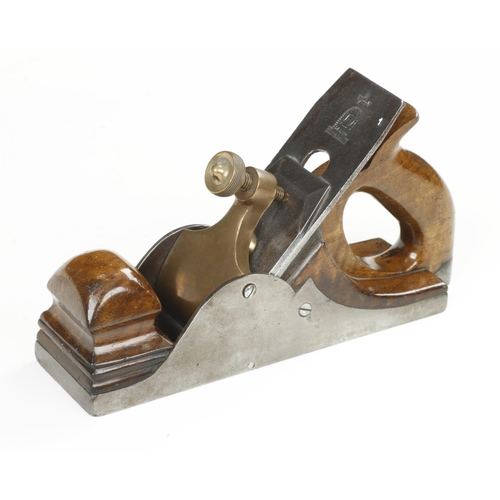 869 - An iron smoother with walnut infill and closed handle with 2 1/4