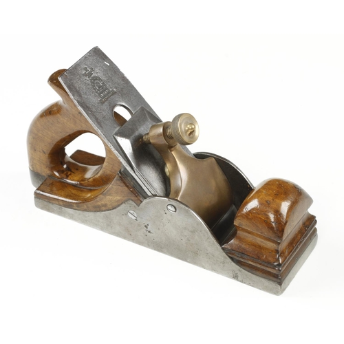 869 - An iron smoother with walnut infill and closed handle with 2 1/4