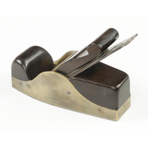 870 - A nice quality steel soled gunmetal smoother with rosewood infill and scrolled wedge and 2