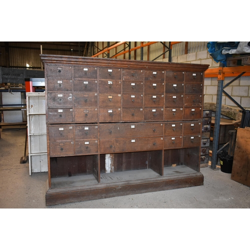 162 - An impressive 42 drawer oak shop fittings 93