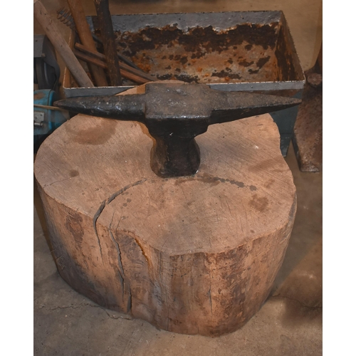 289 - Two blacksmith's quenching troughs, stake anvil and sandstone grinding wheel                       
... 