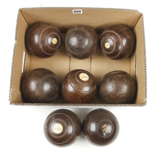 809 - Eight lignum bowls G+