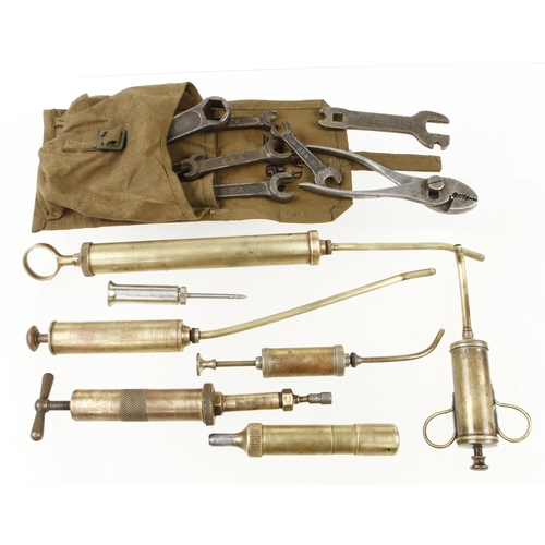 68 - Six brass oilcans and oiler and BSA tool kit G+