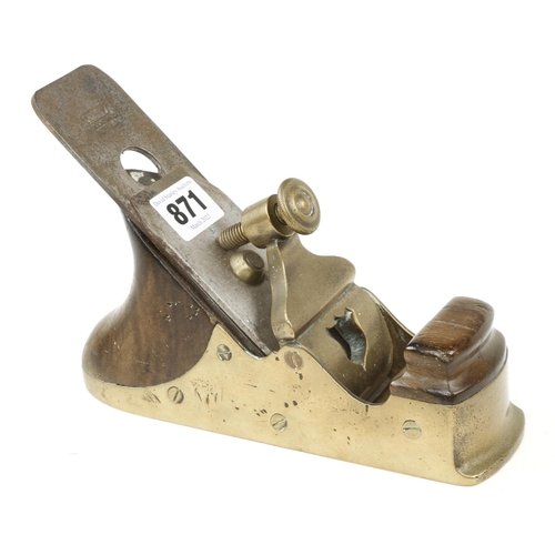 871 - A small Scottish brass smoother with pierced shield design lever and walnut infill and 2