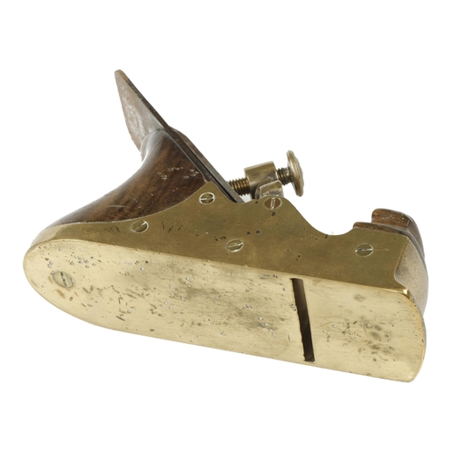 871 - A small Scottish brass smoother with pierced shield design lever and walnut infill and 2