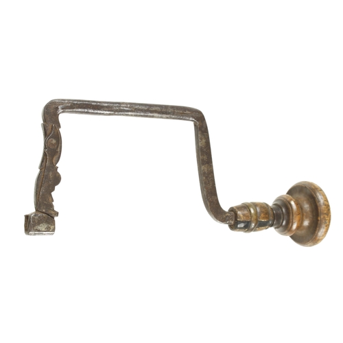 894 - A 17/18c Scandinavian iron brace with elaborate spring to hold the bit G