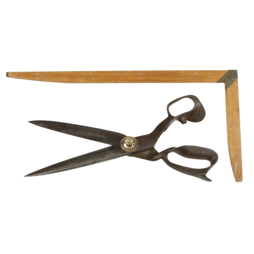 181 - A pair of tailor's steel shears by WILKINSON marked Improved Lined Blades and an 18