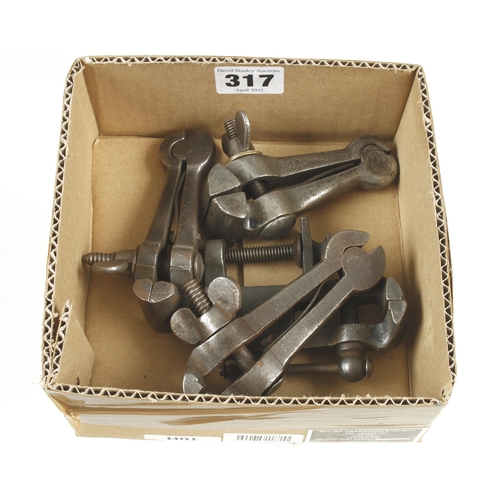 317 - Three hand vices and a small bench vice G