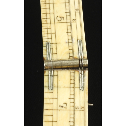 840 - An engineer's 2' four fold ivory rule by RABONE with German silver slide and fittings and Routledge ... 