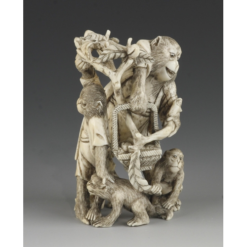 905 - An ivory okimono of a group of 4 monkeys picking fruit into a basket 4