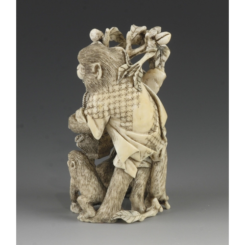 905 - An ivory okimono of a group of 4 monkeys picking fruit into a basket 4