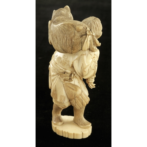 908 - An ivory okimono of a bear catcher struggling with his unruly prize 6