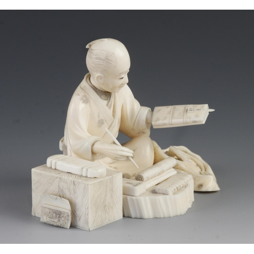 910 - An ivory okimono of a cloth merchant at work 3