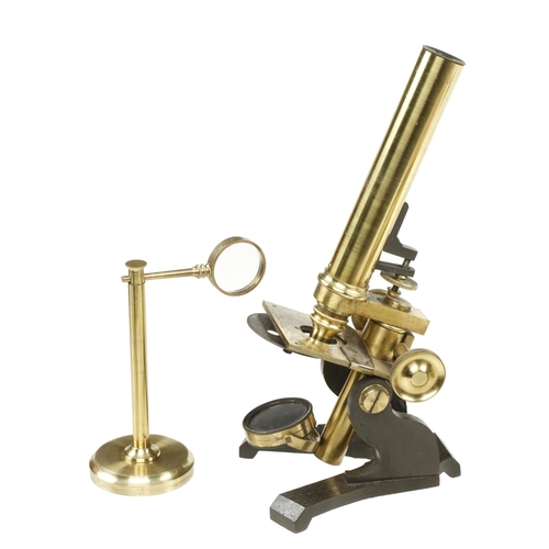 154 - A brass monocular microscope by R.FIELD & SON No 379 with fine focus adjustment and bulls eye conden... 