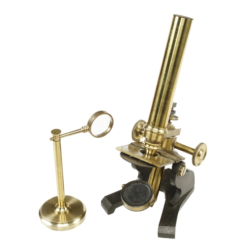 154 - A brass monocular microscope by R.FIELD & SON No 379 with fine focus adjustment and bulls eye conden... 