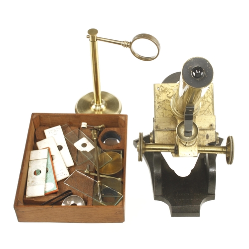 154 - A brass monocular microscope by R.FIELD & SON No 379 with fine focus adjustment and bulls eye conden... 