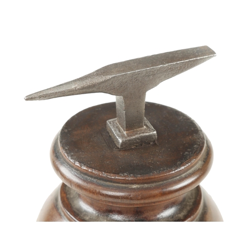 188 - A watchmaker's anvil on mahogany base 9