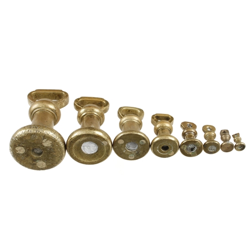 434 - A set of 8 brass bell weights 1oz to 7lbs G