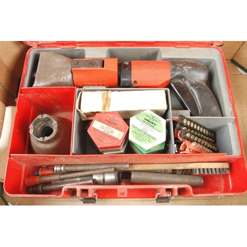 597 - Two impact fixing tools by HILTI and UCAN with cartridges G