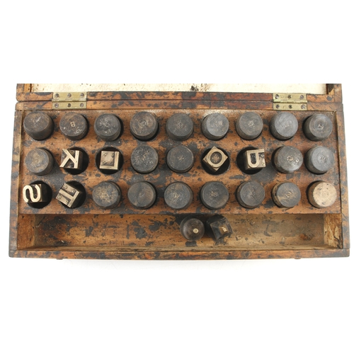 649 - A set of brass letter stamps with wood handles in pine box G+