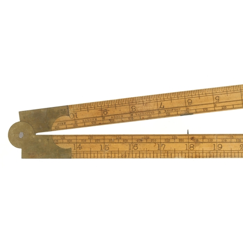 867 - A 2' two fold boxwood and brass engineer's slide rule by RABONE designed by I Routledge Engineer als... 