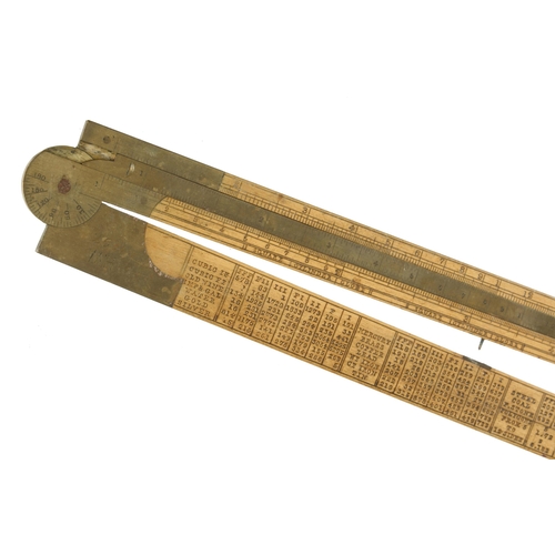 867 - A 2' two fold boxwood and brass engineer's slide rule by RABONE designed by I Routledge Engineer als... 