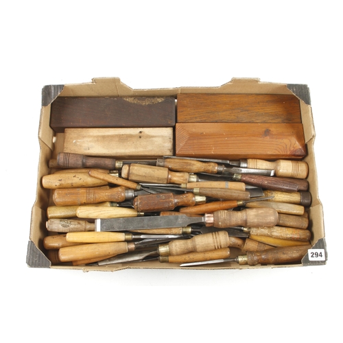 294 - 40 chisels, gouges and carving tools and 3 boxed oilstones G+